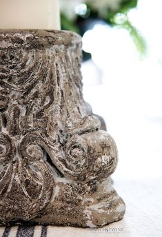 a close up of a vase on a table