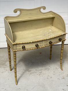 an old wooden desk with two drawers