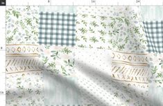 the fabric is white and green with flowers on it