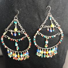 Colorful Beaded Earrings Really Cute On Multicolor Metal Dangle Chandelier Earrings, Handmade Multicolor Metal Chandelier Earrings, Handmade Metal Multicolor Chandelier Earrings, Multicolor Wire Wrapped Beaded Earrings, Multicolor Metal Festival Earrings, Multicolor Metal Earrings With Dangling Beads, Multicolor Beaded Metal Earrings With Ear Wire, Multicolor Metal Dangle Hoop Earrings, Multicolor Metal Beaded Earrings