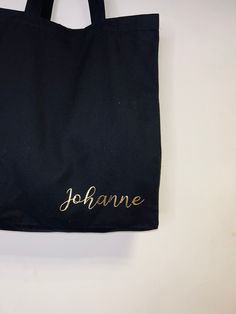 These personalised tote bags are beautifully printed with your own wording in a romantic script font in a choice of metallic colours. These lovely tote bags are the perfect gift for anyone and everyone. The name or word of your choice will be added on the bottom right of your black cotton canvas tote bag in our stunning metallic vinyl foil. A unique gift to add to our collection of items. Depending on your ideas these make a lovely hen party gift, bridesmaids gift ideas or just because. Black canvas bag 100% cotton 42x39x13 Please allow up to 3 working days before despatch for handmade orders. All personalised items are none refunded so please check spellings. Customized Black Rectangular Bag, Black Personalized Canvas Bag For Gift, Customizable Black Canvas Bag For Gift, Customizable Black Canvas Bag For Gifts, Personalized Gold Rectangular Bag, Personalized Rectangular Gold Bag, Personalized Gold Rectangular Bags, Bridesmaids Gift Ideas, Romantic Script Fonts