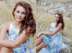 a beautiful young woman sitting on top of a white bench in front of a field