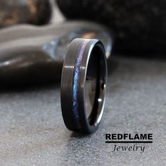 a wedding band with blue and purple opal inlay