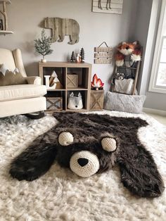 a teddy bear laying on top of a fluffy rug