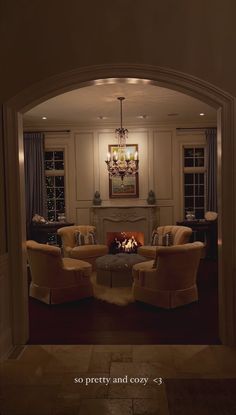 a living room filled with furniture and a fire place in the middle of a room