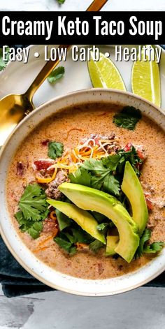 a bowl of creamy keto taco soup with avocado on top