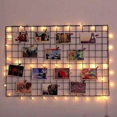 a wall mounted with pictures and lights in the shape of squares on it's sides