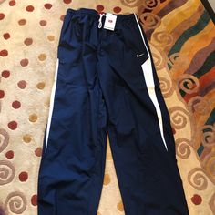 Nave And White Nike Teamcoaches Pants Excellent Condition The Date On The Tag Is 2006 Zippers At Ankles Retro Nike Pants, Vintage Nike Pants Old, Vintage Nike Parachute Pants, Navy Blue Nike Track Pants, Blue Vintage Nike Track Pants, Nike Sweatpants Mens, Nike Track Pants, Mens Joggers Sweatpants, Black And White Pants