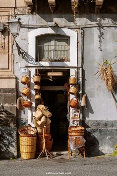 baskets are lined up in front of an old building