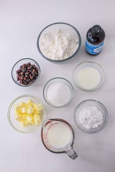 the ingredients to make chocolate chip cookies laid out in bowls