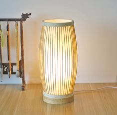 a lamp sitting on top of a wooden floor