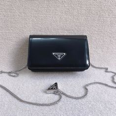 Size: 19cm*10cm*3.5cm It comes with Dust box, Care manual, Tag, and Paper bag. Designer Mobile Phone Clutch, Designer Rectangular Mobile Phone Clutch, Designer Rectangular Box Bag With Case Included, Designer Mobile Phone Clutch As Gift, Designer Rectangular Clutch For Mobile Phone, Designer Rectangular Mobile Phone Evening Bag, Designer Black Clutch In Rectangular Case, Designer Black Clutch With Rectangular Case, Designer Black Rectangular Clutch