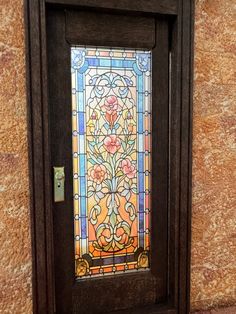 a stained glass door with a wooden frame