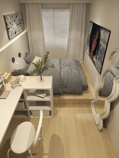 a bedroom with a bed, desk and chair in it