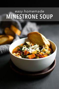 a bowl of homemade minestone soup with bread on the side and text overlay