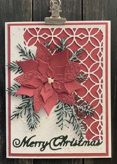 a christmas card with a poinsetti on it