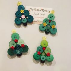 three green buttons with stars and bows on them