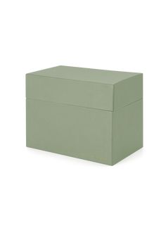 a green box sitting on top of a white surface