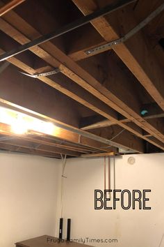 an unfinished room with exposed beams and the words before