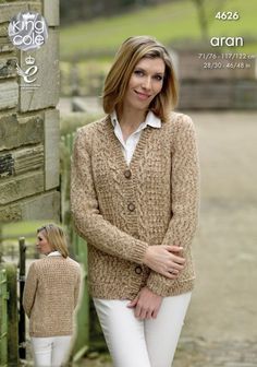 a woman wearing a cardigan sweater and white pants