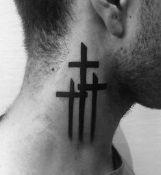 a man with a cross tattoo on his neck