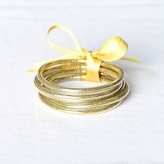 Add accessories to your outfit without the noise :) NEW jelly bangle sets! Includes 5 bangles in each set. Glitter and sequin filled. Jelly Bracelets, Tube Bracelet, Bracelet Stacks, Bangle Bracelet Set, Stacked Bangles, Exclusive Gift, Dark Gold, Bangle Set, Toy Sale