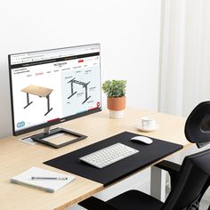 a desk with a computer monitor, keyboard and mouse sitting on it's side