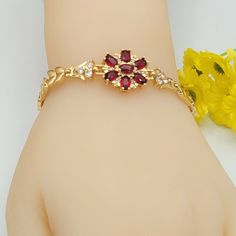 Beautiful Flower Bracelet with red crystals Pulsera de Oro Laminado Size: 7 in   18K Gold Plated We seek to do the best in our work, if there is any problem, please let us know to fix it ASAP. God bless you! U.S. Seller:  Shipping with tracking number. Gold Ruby Bracelets For Party, Gold Ruby Bracelet For Party, Gold Flower Bracelets For Valentine's Day, Red Flower Bracelets For Valentine's Day, Red Flower Shaped Festive Jewelry, Red Flower-shaped Festive Jewelry, Gold Flower-shaped Bracelets For Party, Elegant Red Flower-shaped Jewelry, Red Flower Shaped Jewelry For Formal Occasions