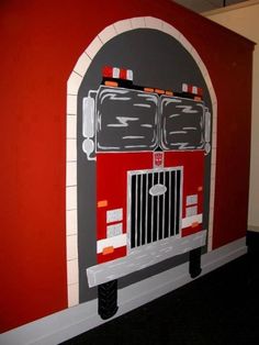 a fire truck painted on the side of a wall