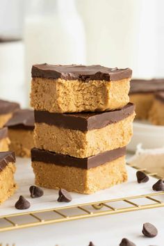 chocolate and peanut butter bars stacked on top of each other