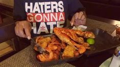 a person sitting at a table with some food