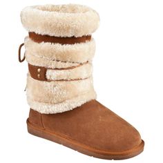 Lock out the cold this winter with a fashion forward look in the Bernie Shearling Winter Boots from Natural Reflections. Combining a genuine suede leather upper with a warm shearling lining, this sheepskin-style boot keeps your feet warm and cushioned. Under your foot, a padded sock provides further cushioning and insulation. A non-skid TPR outsole keeps you on your feet, indoors and out. Average height: 9". Imported.   Wintertime warmth with a sheepskin boot look  Genuine suede leather uppers Boots For Ladies, Tanning Skin Care, Lock Out, Boho Boots, Country Girls Outfits, Sheepskin Boots, Shearling Boots, Ladies Shoes, Bearpaw Boots