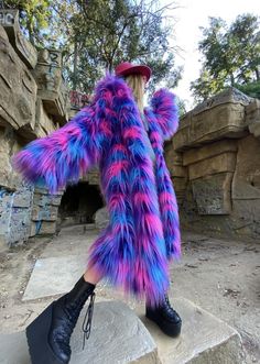 🌈 Embrace the festival spirit with the "Psychedelic Prowler," a coat that's as bold and dynamic as you are. Crafted for the eco-conscious reveler, this unisex faux fur coat boasts a vivid palette that mirrors the vibrant energy of Burning Man and other festival landscapes. ✨ Each "Psychedelic Prowler" is handmade, ensuring every detail reflects our commitment to quality and sustainability. The luxurious eco-fur not only looks stunning but feels incredibly soft, allowing you to party in comfort without sacrificing style. 🎶 With its detachable sleeves, the coat adapts seamlessly to the fluctuating climates of the desert, making it ideal for daytime exploration or nighttime festivities. It's not just a coat--it's your ultimate festival companion, designed to make you stand out in every crow Uk Rave Aesthetic, Fall Rave Outerwear With Long Sleeves, Rave Long Sleeve Outerwear For Fall, Fall Rave Long Sleeve Outerwear, Purple Winter Costume Outerwear, Funky Multicolor Winter Outerwear, Funky Long Sleeve Winter Outerwear, Long Purple Winter Outerwear, Bohemian Winter Costume Outerwear