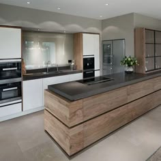 a modern kitchen with an island counter top