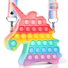 an image of a toy that looks like a rainbow horse with lots of circles on it