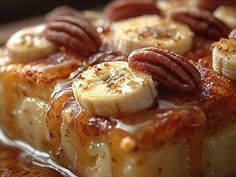 bananas and pecans on top of some kind of bread with caramel drizzle