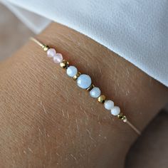 This fertility bracelet is made with gemstones that are said to bring support for a successful and safe pregnancy. It is a great gift for your loved ones that are in the process of getting pregnant or that are currently going through IVF. It makes the perfect meaningful mom to be gift! ♥ ✦ MATERIALS: ~ Natural Rose Quartz, Moonstone, Aquamarine Gemstones (3-4mm) ~ Nylon cord in beige ~ Gold Hematite stones Filled  ✦ Your bracelet will be packed in a hand made envelope with a brand logo, making it perfect for gifting ✦ If you want to give jewelry to a loved one and leave a message for them, give me its content in the message when buying ✦ More Bracelets - www.etsy.com/shop/LaCannet?section_id=30596478 ✦ My shop - https://www.etsy.com/pl/shop/LaCannet Fertility Bracelet, Bracelets Design, Hematite Stone, Jewelry Dainty, Mom To Be, Wish Bracelets, Quartz Rose, Gift Jewelry, Stylish Jewelry