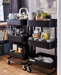 an image of a cart full of items on top of a wooden table with the caption above it