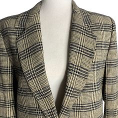 Vintage 70s Wool Blazer Jacket 10 Black Tan Plaid Lined Notch Collar ButtonExcellent conditionNo fabric tags, feels like a wool blendChest: 19" laying flatSleeves: 21"Length: 27" shoulder to hem Wool Career Blazer With Button Closure, Classic Long Sleeve Tweed Jacket For Career, Single Button Long Sleeve Tweed Jacket For Fall, Retro Formal Fall Outerwear, Vintage Button-up Tweed Jacket For Fall, Wool Button-up Blazer, Classic Wool Blazer With Snap Buttons, Fall Blazer With Buttons And Flat Front, Retro Tailored Long Sleeve Blazer