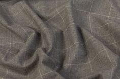 This wool has a medium weight and a soft touch perfect for winter suiting. This wool also has a light two-way stretch. Single-breasted Wool Suit For Tailoring, Luxury Gray Wool Suit, Timeless Wool Single-breasted Suit, Timeless Single-breasted Wool Suit, Grey Wool Fabric, Wool Suit, Medium Weight, Wool, Grey