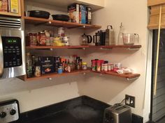 the kitchen is stocked with various items and things to cook in it's cupboards