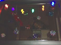 an image of christmas lights in the window