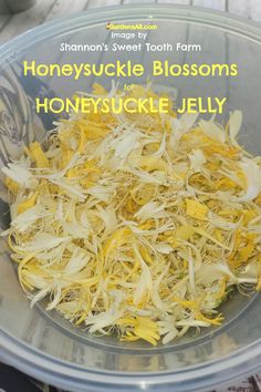 a bowl filled with shredded yellow flowers on top of a table