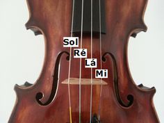 an old violin with the words sol re la mi on it's back side