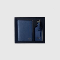 a blue bottle and wallet in a black box