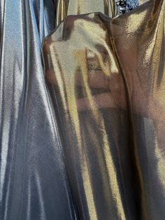 metallic chiffon fabric sold by yard  see through fabric  fabric is not stretchy  2 colors available Silver on black Gold on black Measurements: fabric width - 60" Futuristic Fabric, Techno Club, Contrast Photography, Hair Aesthetics, Holographic Fabric, Sea Dress, Fabric Board, Band Ghost, Age Of Aquarius