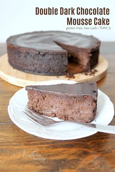 a piece of chocolate cake on a plate with a fork