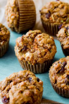 several muffins sitting on top of a blue napkin