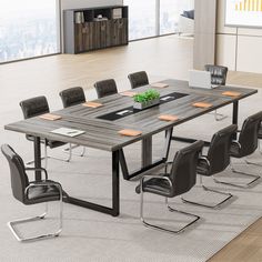 a large table with chairs around it in an office