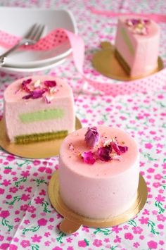 there are two cakes on the table with pink flowers